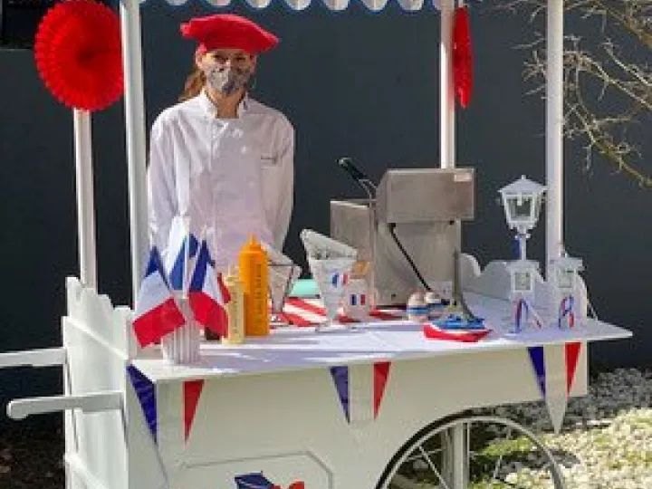 Fries cart decorated with French flags for a themed party